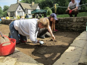 Jackie (who's birthday was today) Harriet and Hannah digging up the gravel and tarmac