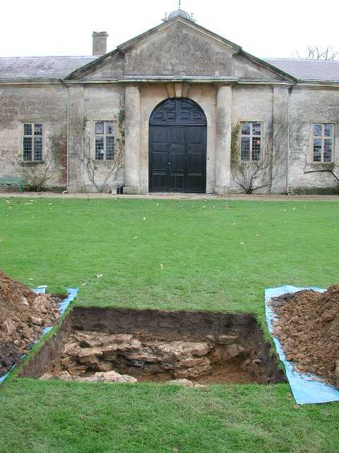 The trench in the lawn in front of Dyrham's stables.  This found the footing for the sphynx statue shown on the 1712 drawing.