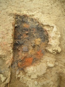 The clay layer removed and the pottery sherd is near the bright orange area