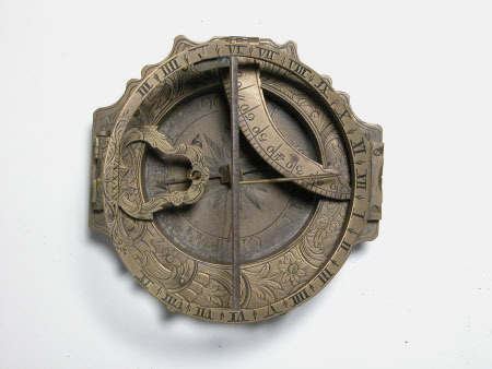 Engraved brass pocket compass and sundial with German inscription on the reverse the last letters reading 'And. Vogh'. Folding with a shaped outer rim. Part of the NT collection from Snowshill Manor Glos.